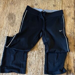 Nike Black Joggers with White Trim.         F